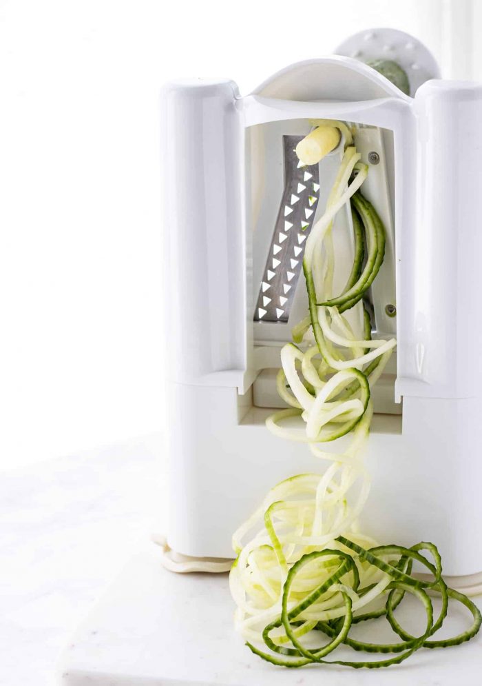 a spiralizer with cucumber noodles