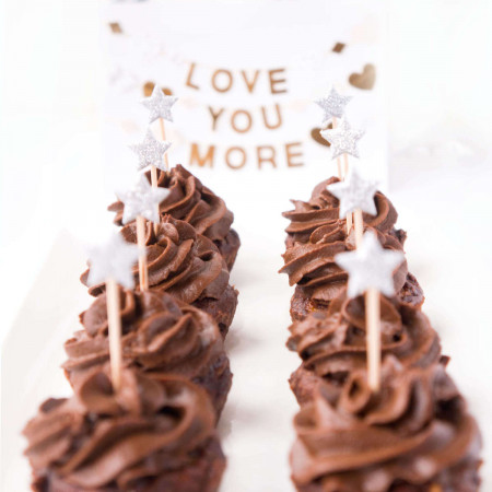 Two lines of No-Sugar Added Chocolate Brownie Cupcakes in front of a sign that says "Love You More"