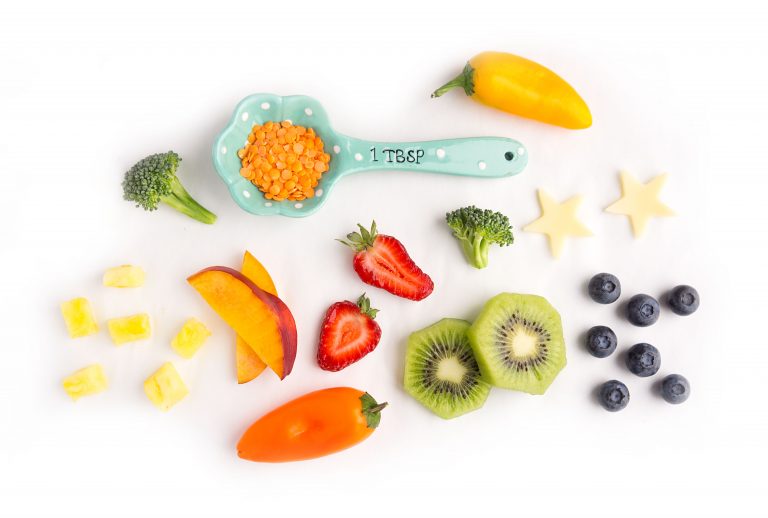 Bright food and a tablespoon measurer