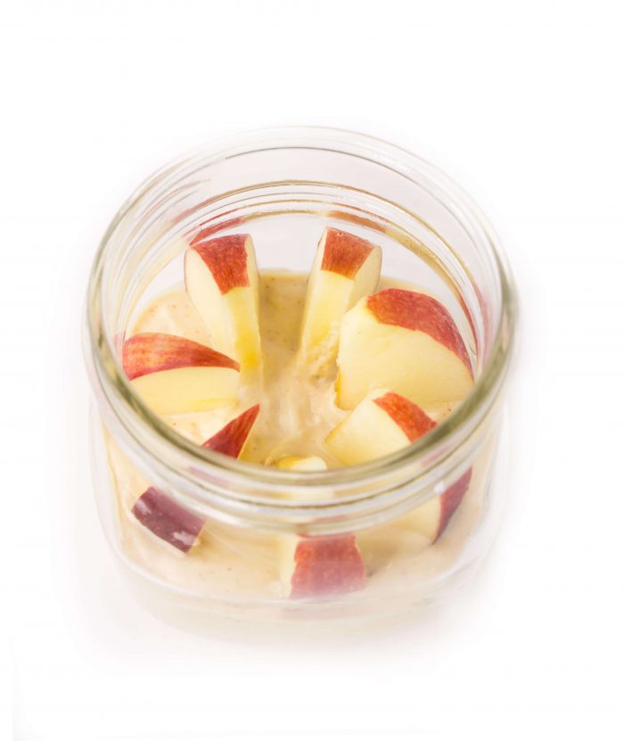 Mason jar with apples in Greek yogurt peanut butter dip