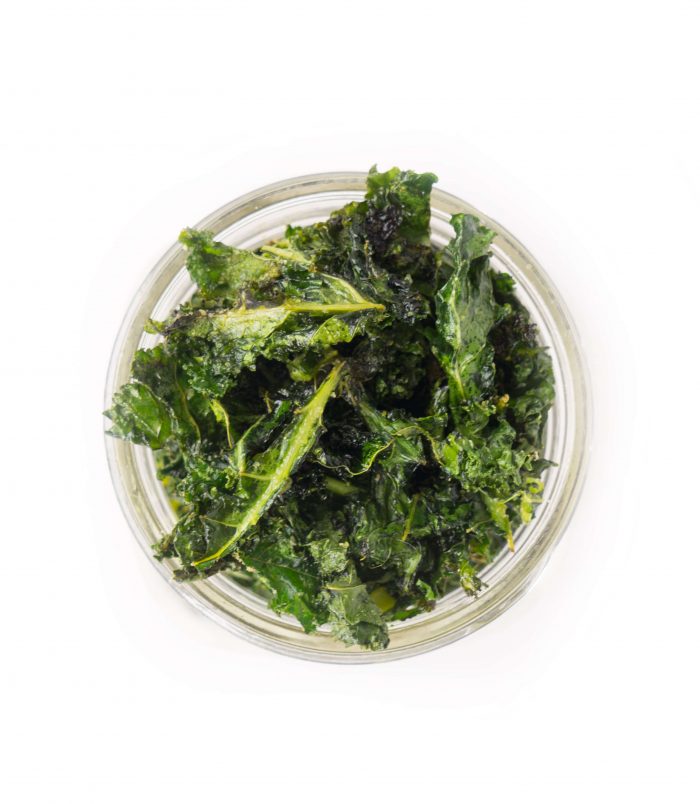Overhead shot of a mason jar filled with kale chips