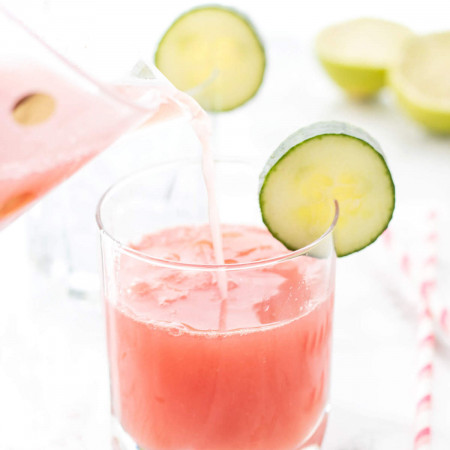 Pitcher pouring Watermelon Cucumber Spritzer in a glass