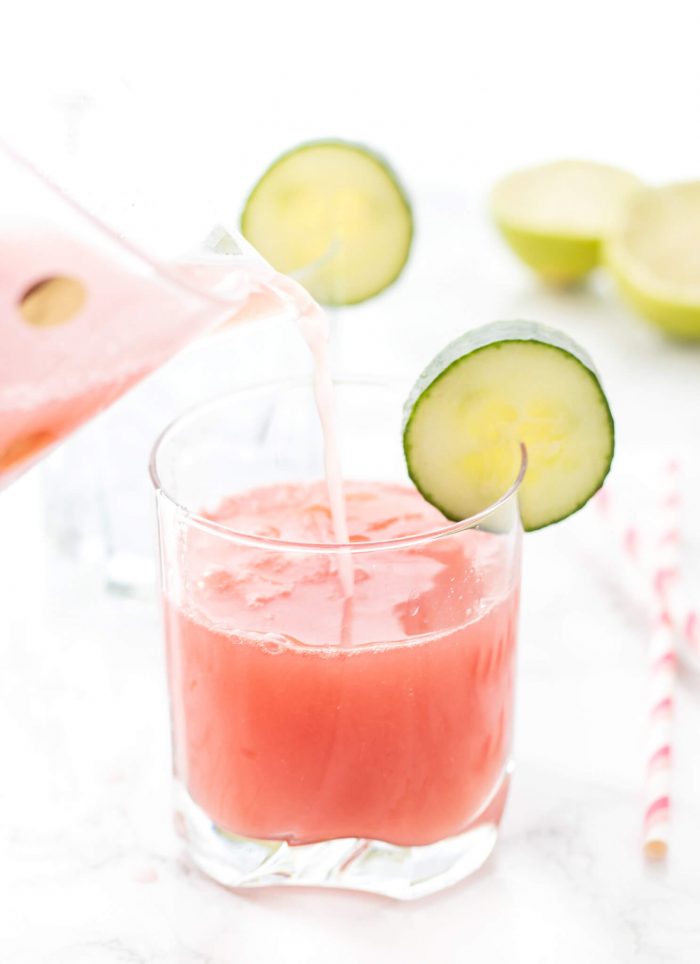 Pitcher pouring Watermelon Cucumber Spritzer in a glass