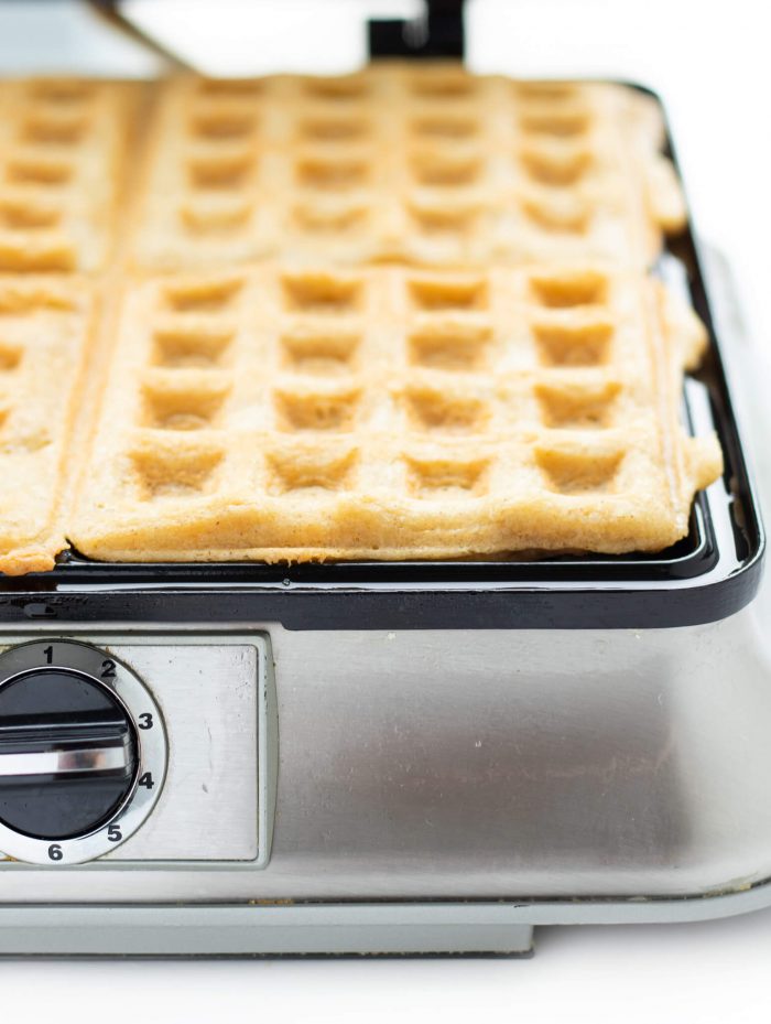 Paleo Waffles being cooked in a waffle iron