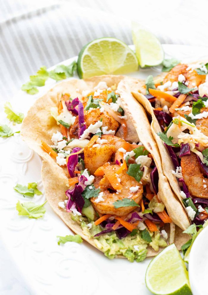 spicy shrimp tacos served with lime wedges
