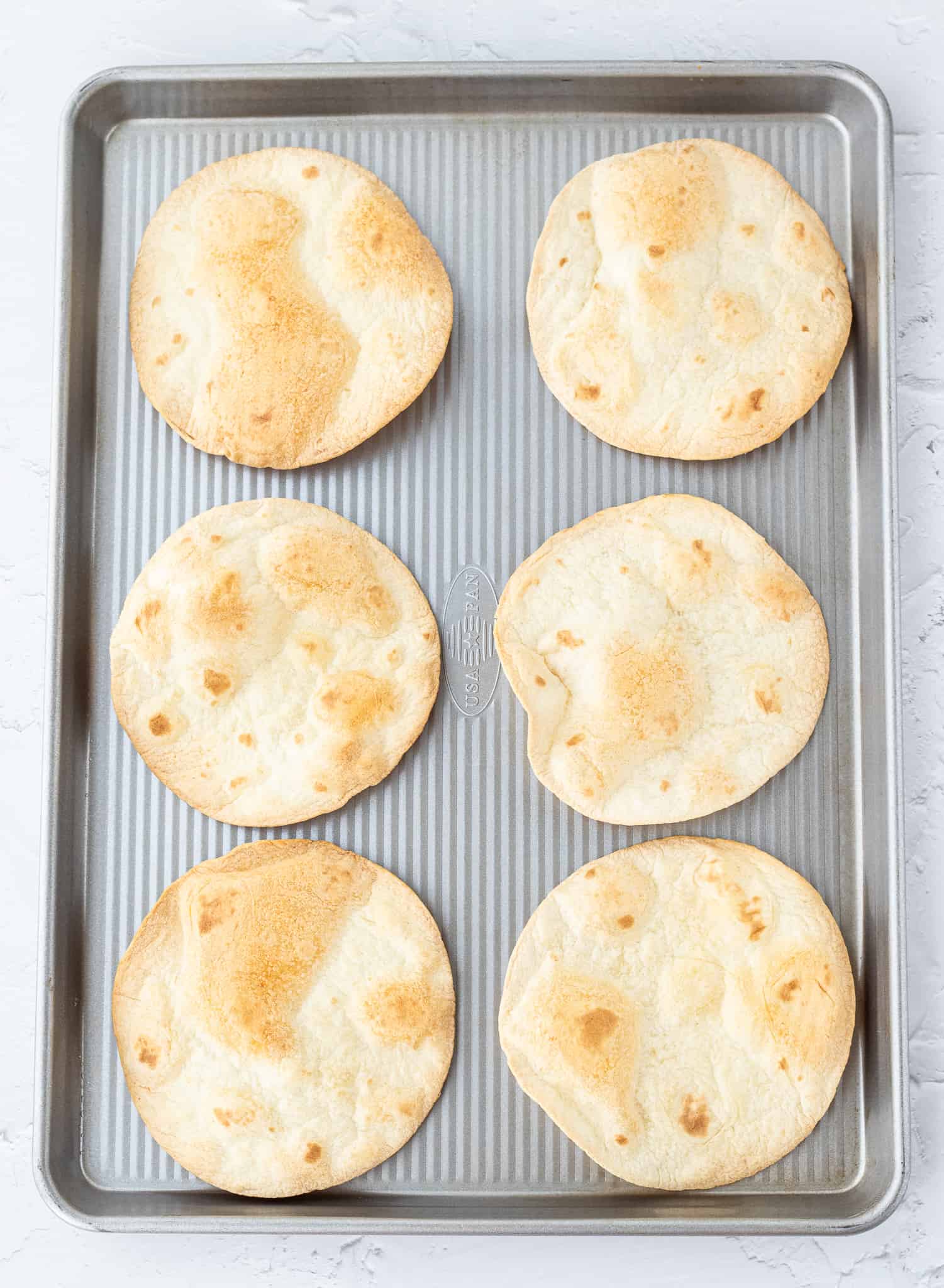 Crispy tortillas on baking sheet