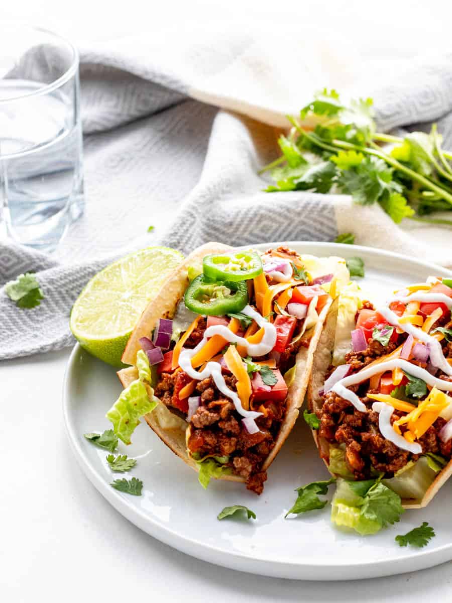 Crock Pot Taco Meat Pot taco meat in tortillas and topped with jalapenos and sour cream/