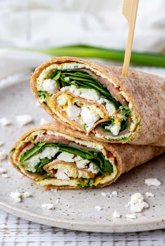 Two egg white wrap halves secured with a toothpick.