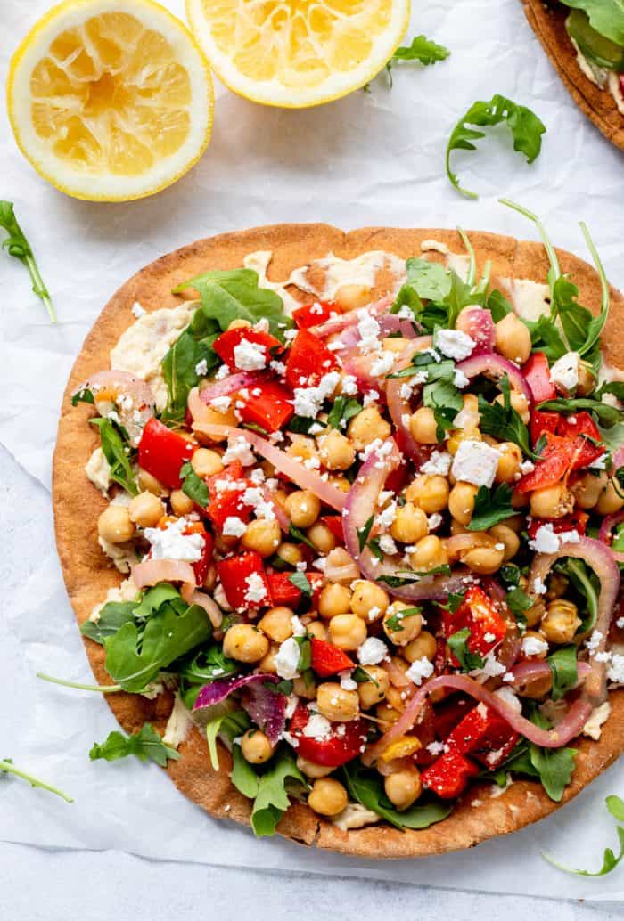Meditteranean chickpea salad served on top of toasted pita bread.