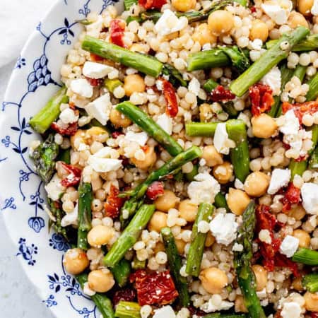Overhead shot of pearl couscous salad with roasted asparagus and chickpeas