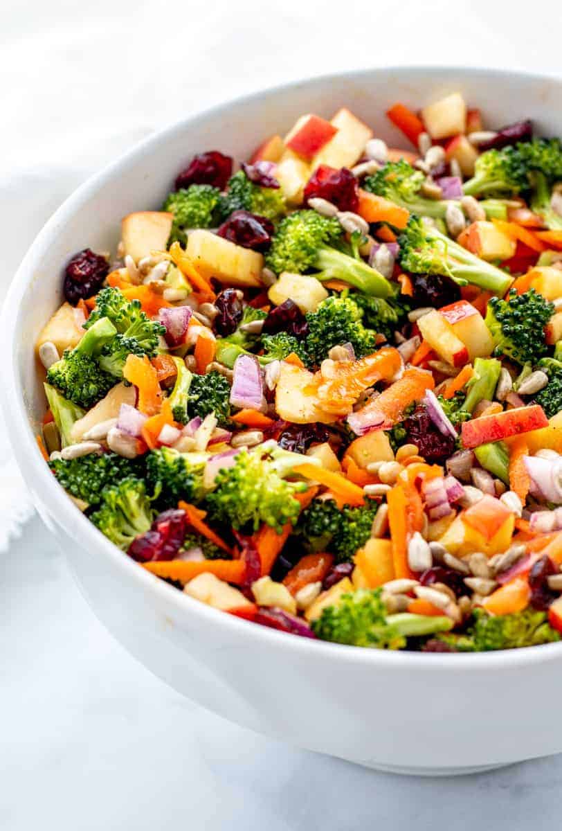 Close up of broccoli cranberry salad in a large white bowl