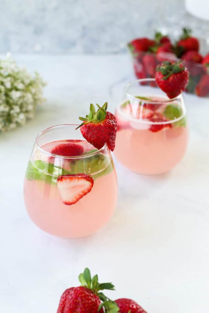 Two glasses of strawberry mocktail spritzer ready to drink.