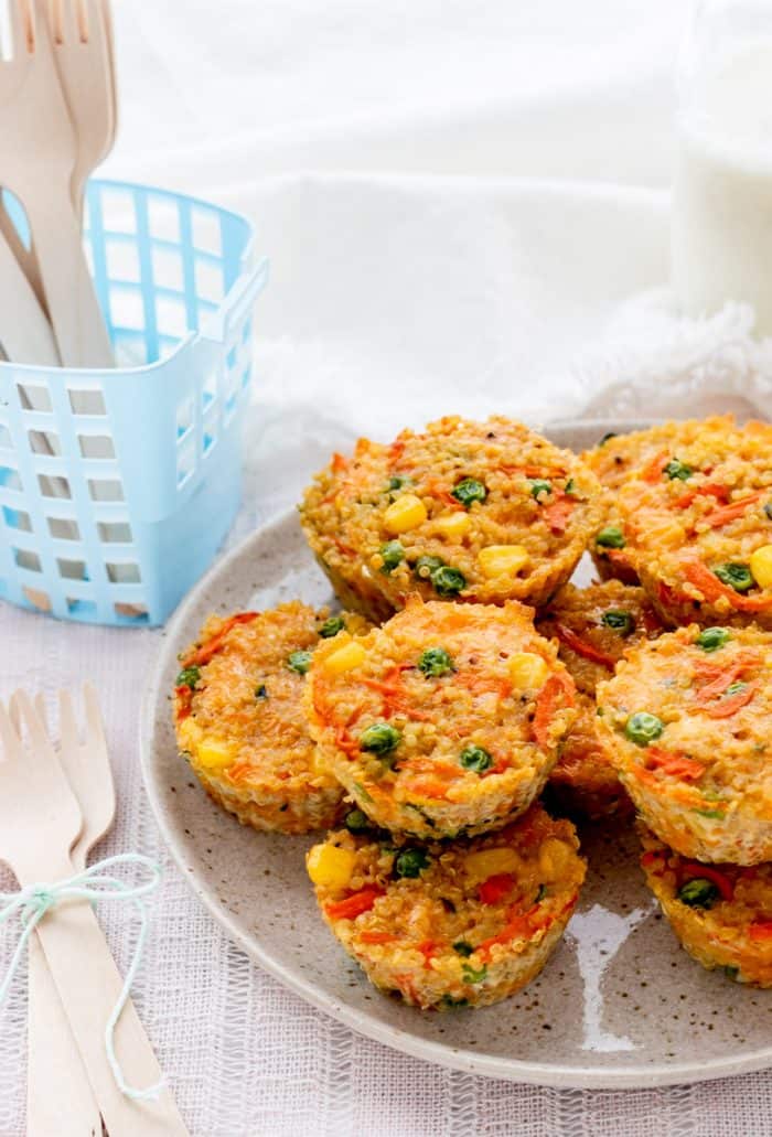 Close up of stacked quinoa muffins on a plate.