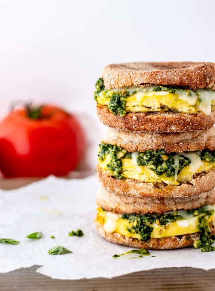 Close up of three healthy breakfast sandwiches with pesto.