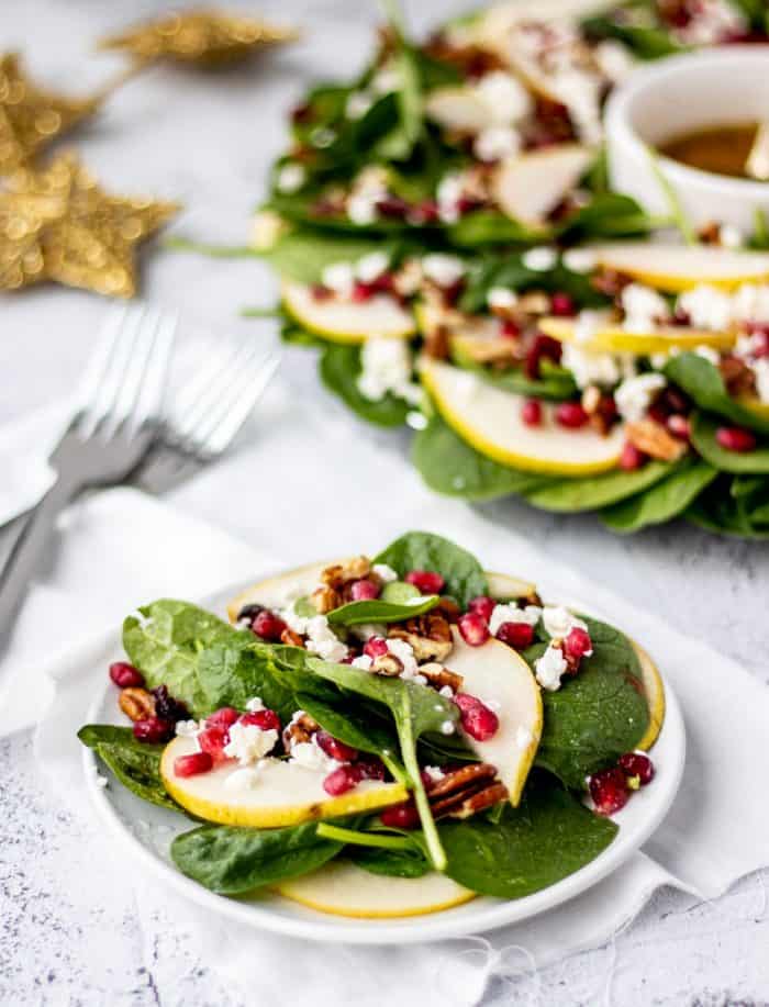 pear and pomegranate salad on a small serving plate
