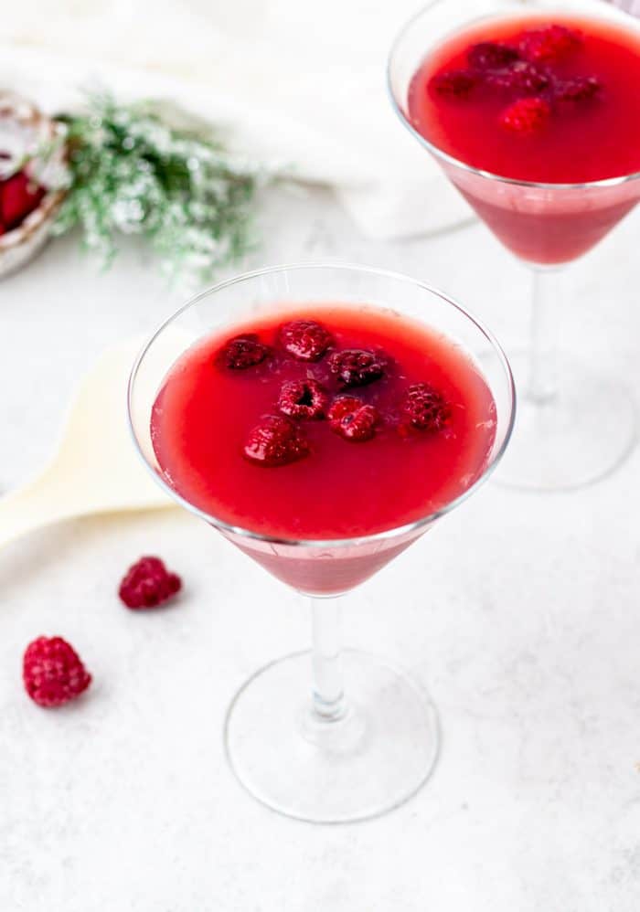 glasses of holiday punch with raspberries