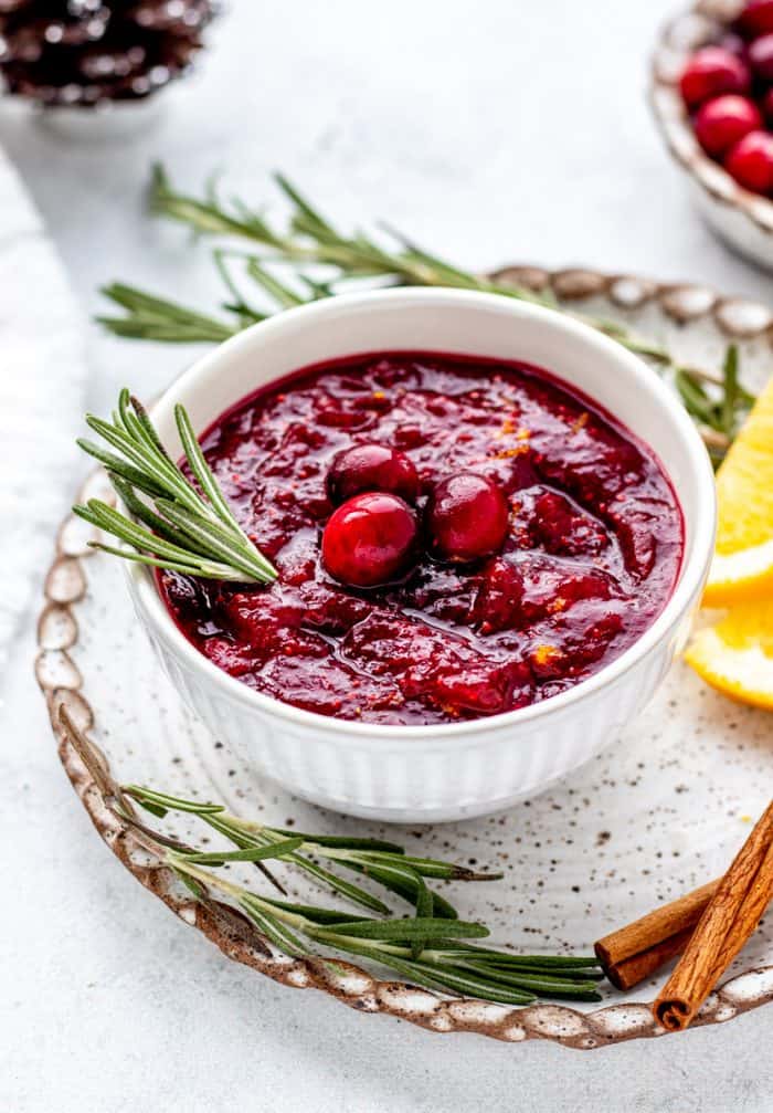 Healthy cranberry sauce topped with fresh cranberries.
