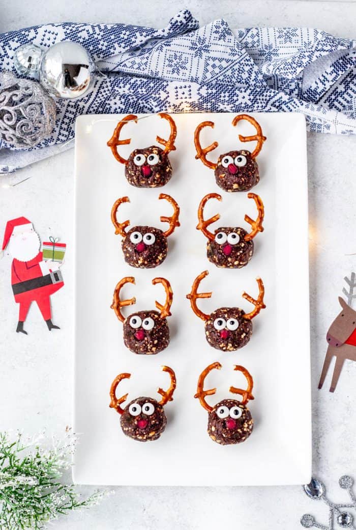 reindeer bites on a white rectangle tray surrounded by Christmas decorations