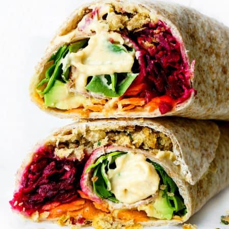 Close up of two halves of the falafel wrap stacked on top of each other.