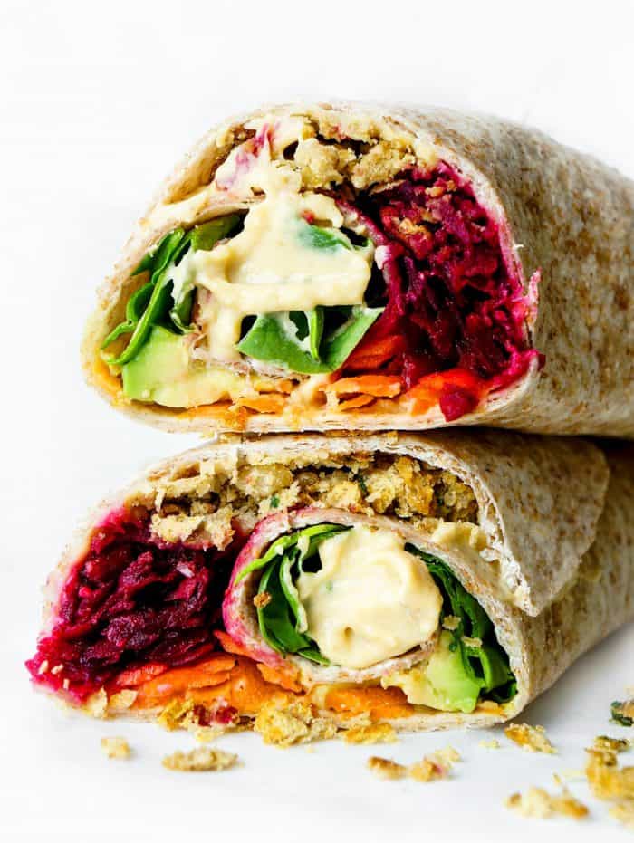 Close up of two halves of the falafel wrap stacked on top of each other