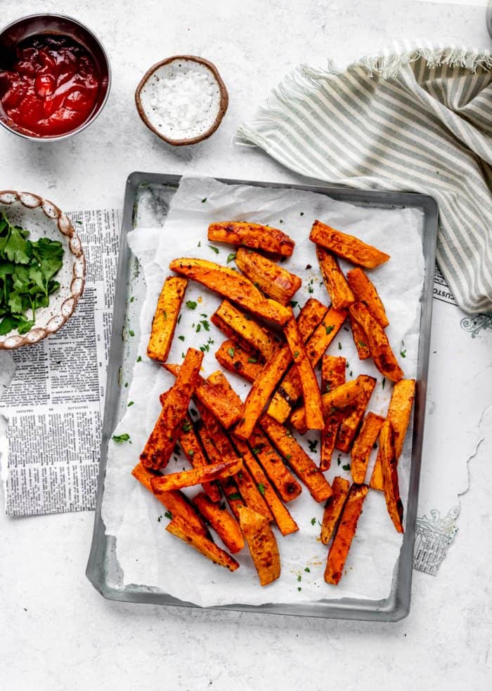 baked sweet potato fries on a tray.