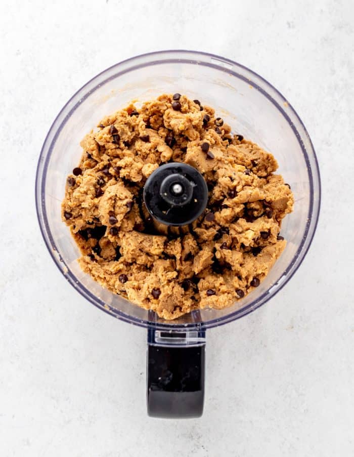 Chocolate chips mixed into the raw vegan cookie dough.