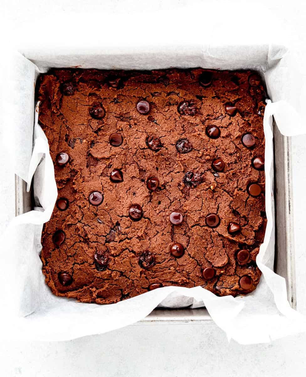 baked brownies in a square pan topped with chocolate chips