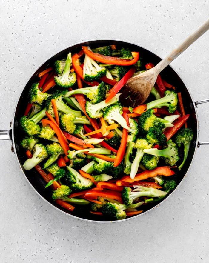 Cooking the vegetables in a skillet.
