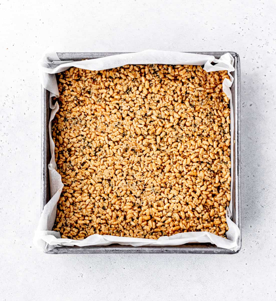 The rice cereal mixture pressed into a pan.