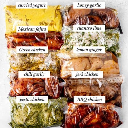 Ten healthy chicken marinades in freezer bags with chicken.