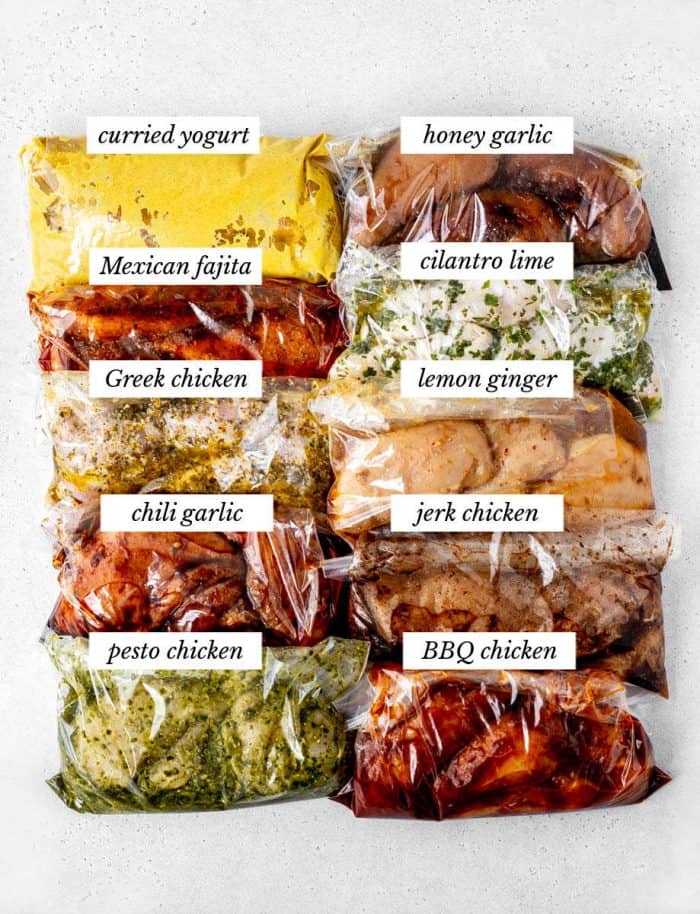 Ten healthy chicken marinades in freezer bags with chicken.
