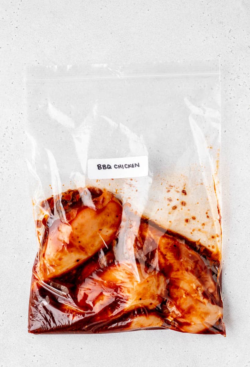 BBQ chicken in freezer bag with label.
