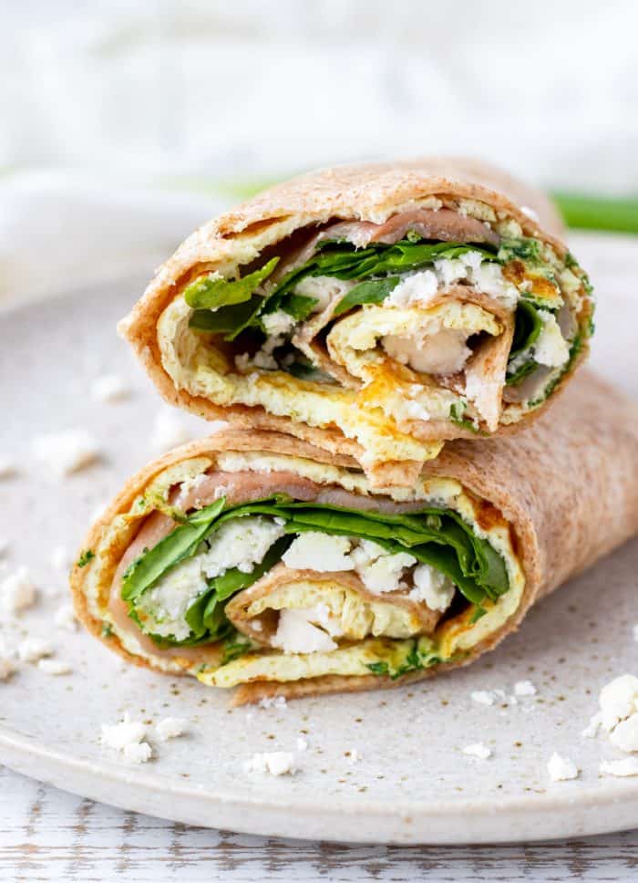 Two halves of an egg white wrap stacked on top of each other.