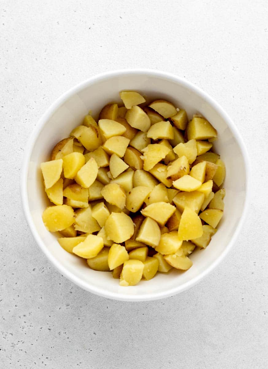 Potatoes chopped and added to a large bowl.