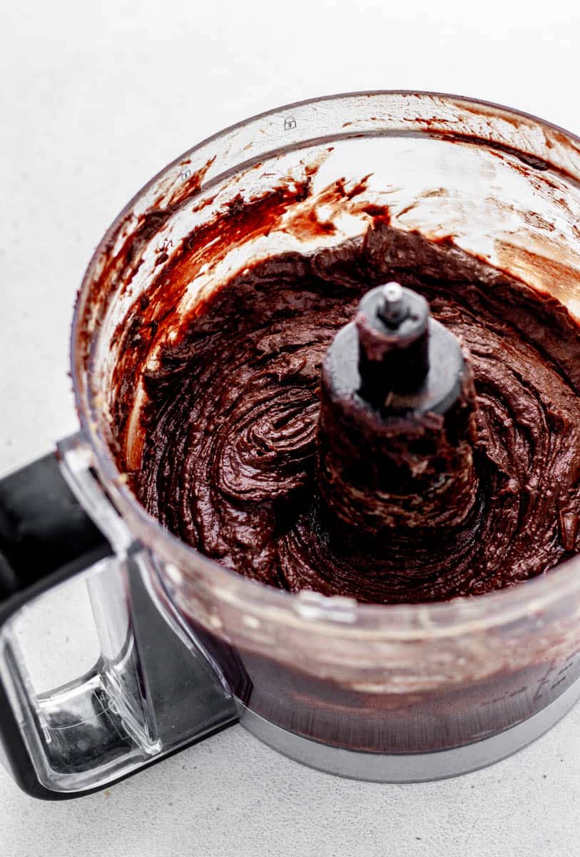 Chocolate cake batter mixed together in a food processor.
