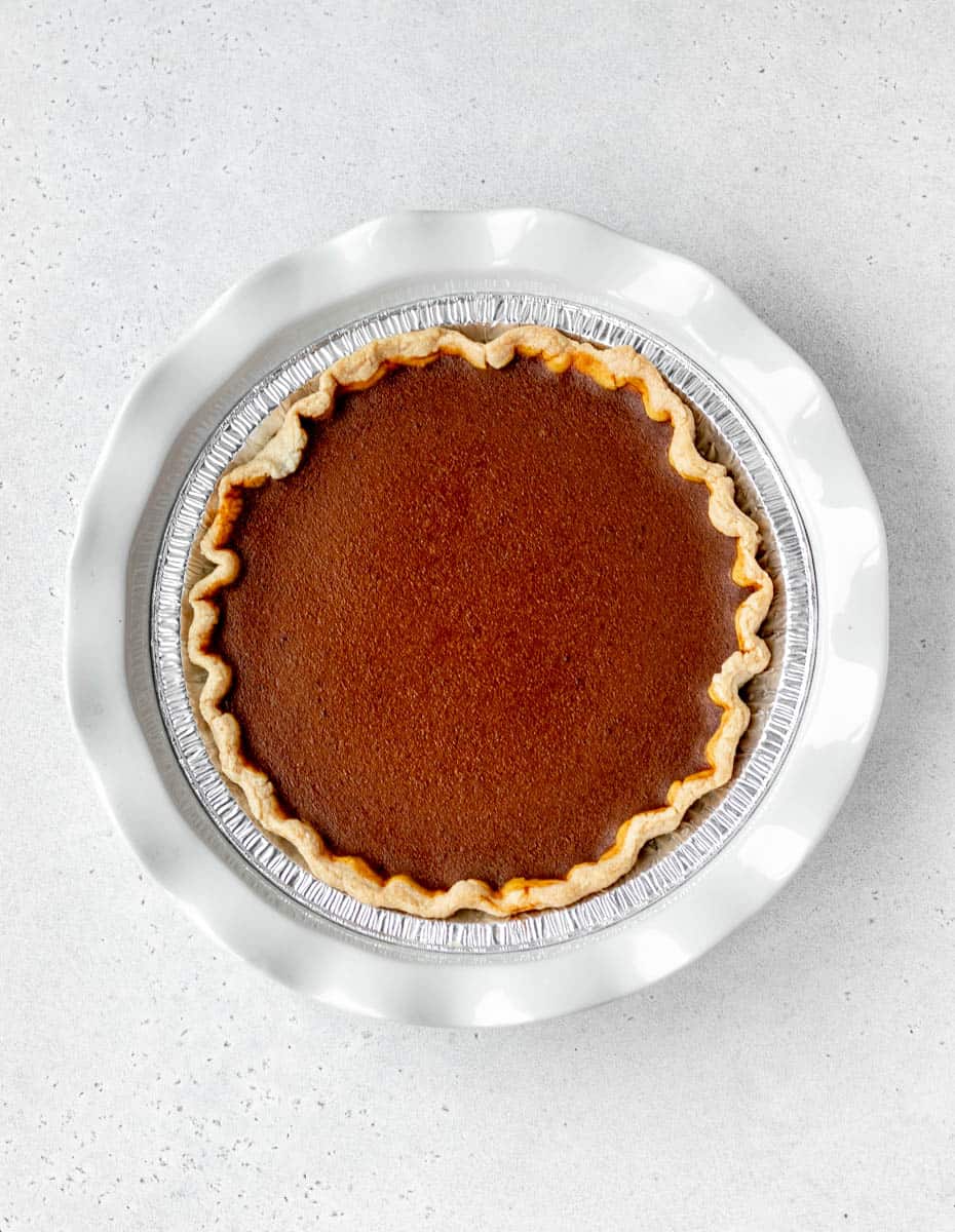 Overhead image of a baked pumpkin pie without evaporated milk.