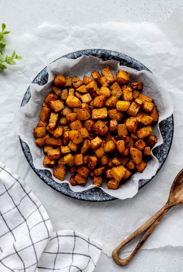 A bowl of sweet roasted air fryer butternut squash cubes.