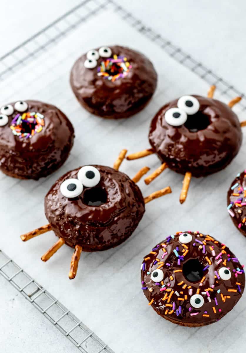 Image of halloween donuts on a wire cooling wrack.