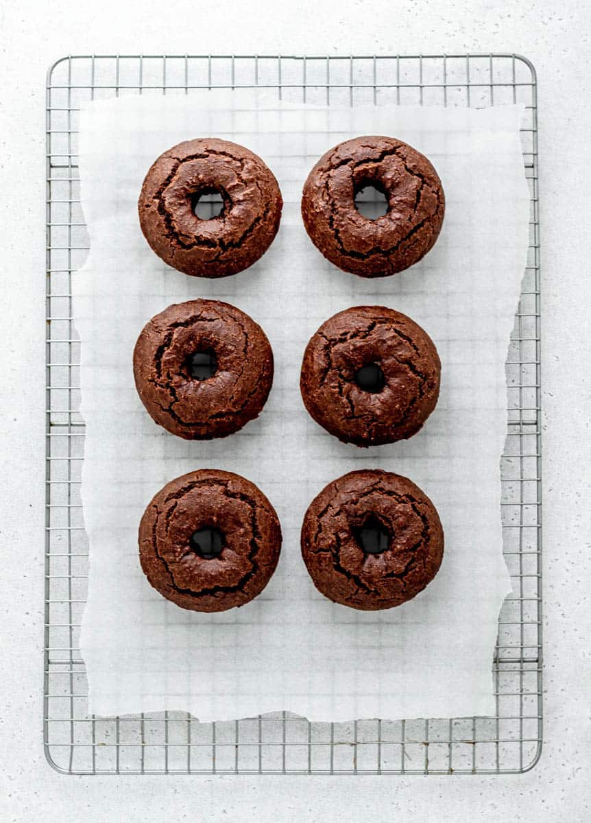 Yeast free chocolate baked donuts on a cooling wrack.