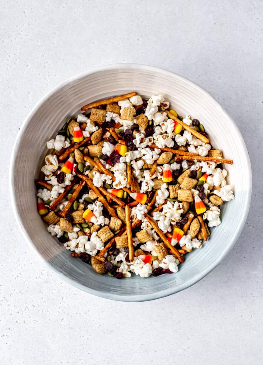 A large bowl filled with Halloween snack mix.