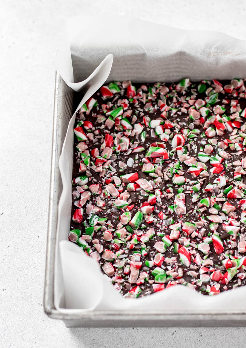 A close up of Christmas fudge in a baking pan.