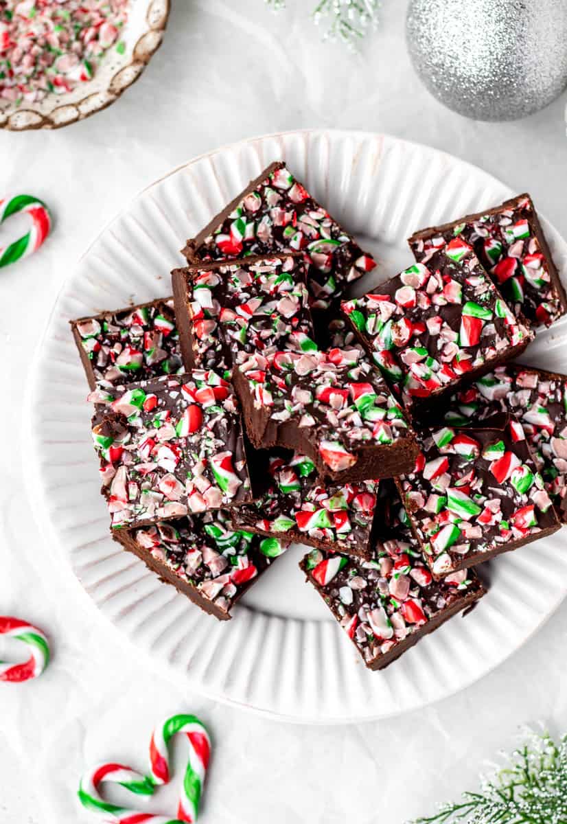 A top down view of 3 ingredient Christmas fudge on a white serving plate.