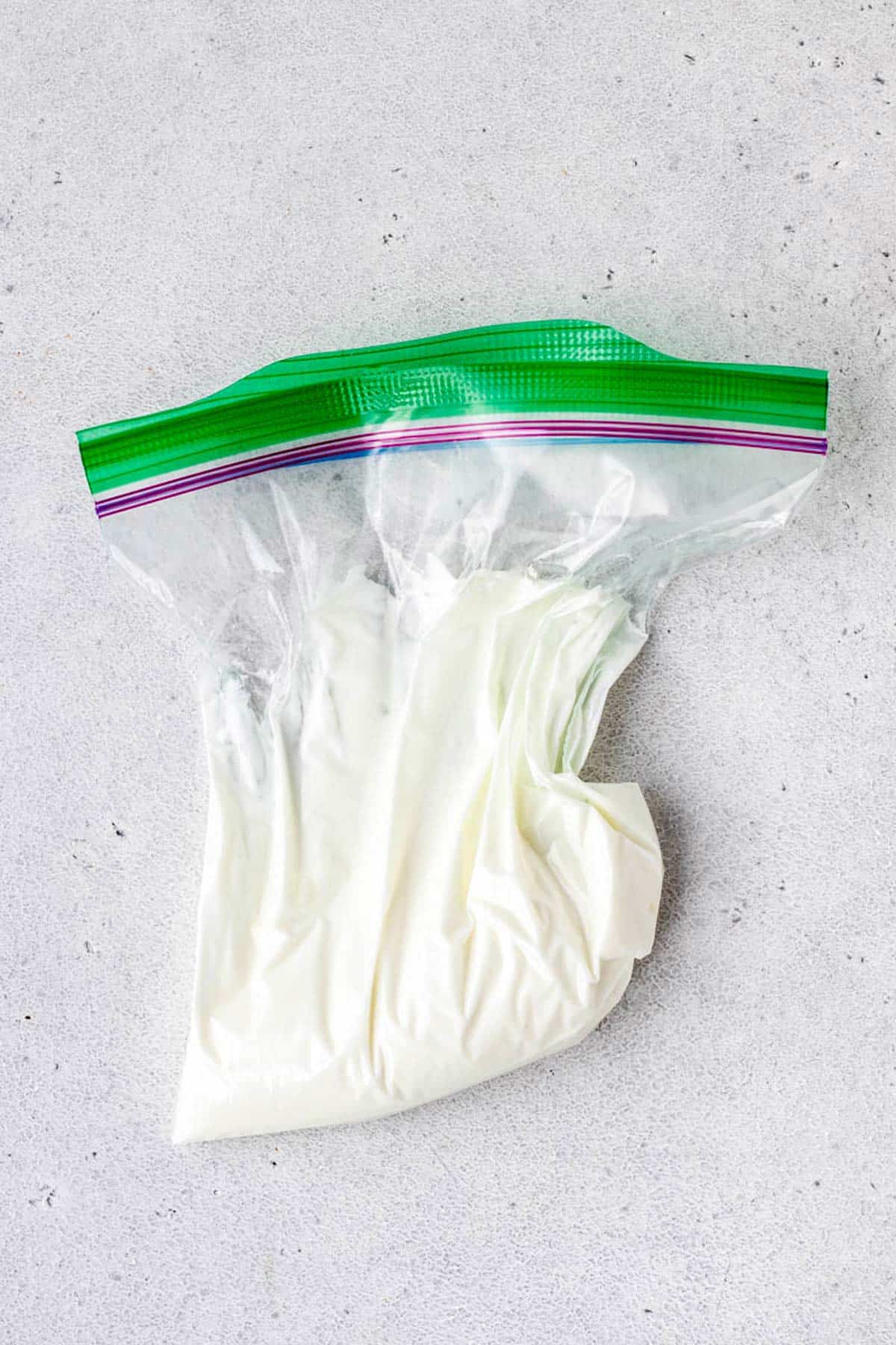 A zipper plastic bag filled with Greek yogurt.