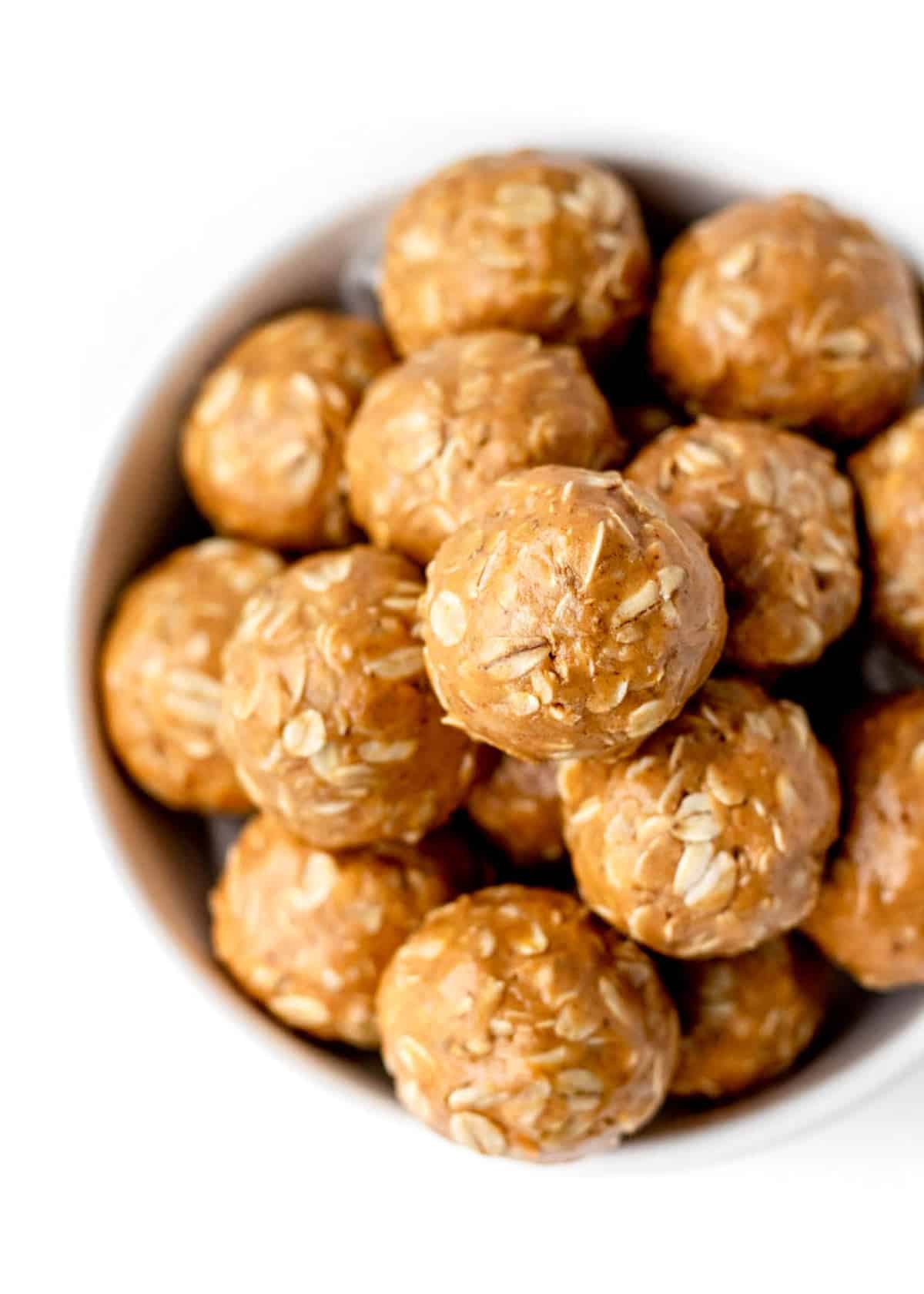 Up close overhead shot of oatmeal balls in a bowl.