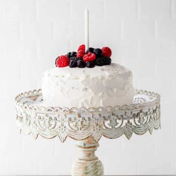 A birthday smash cake on a cake stand.