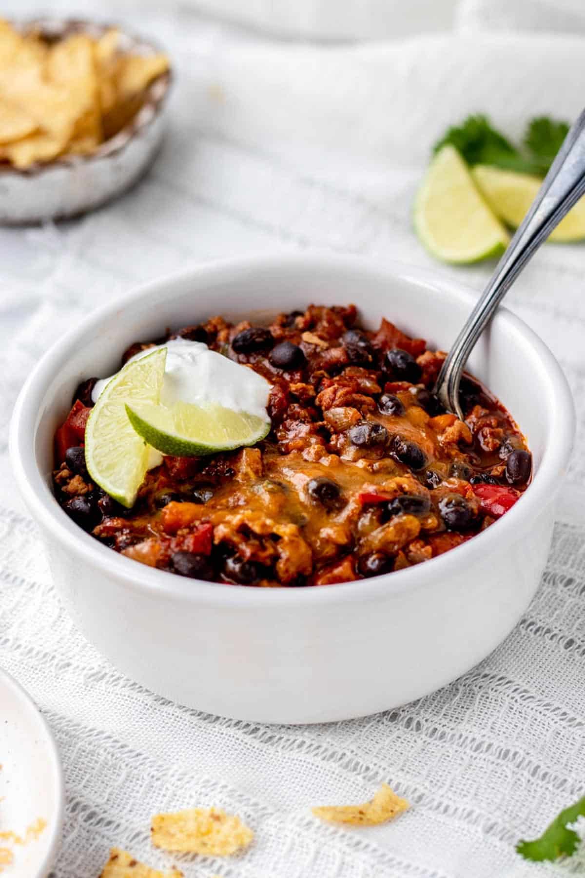 A closeup of a bowl ground turkey chili.