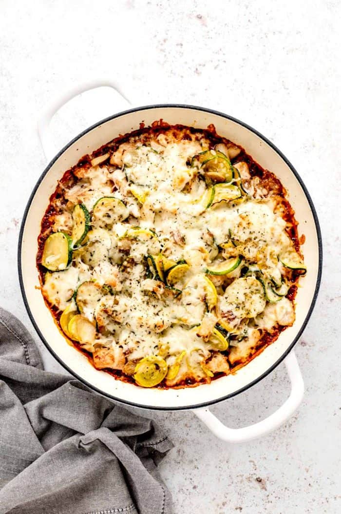 The baked chicken zucchini casserole in a Dutch oven.