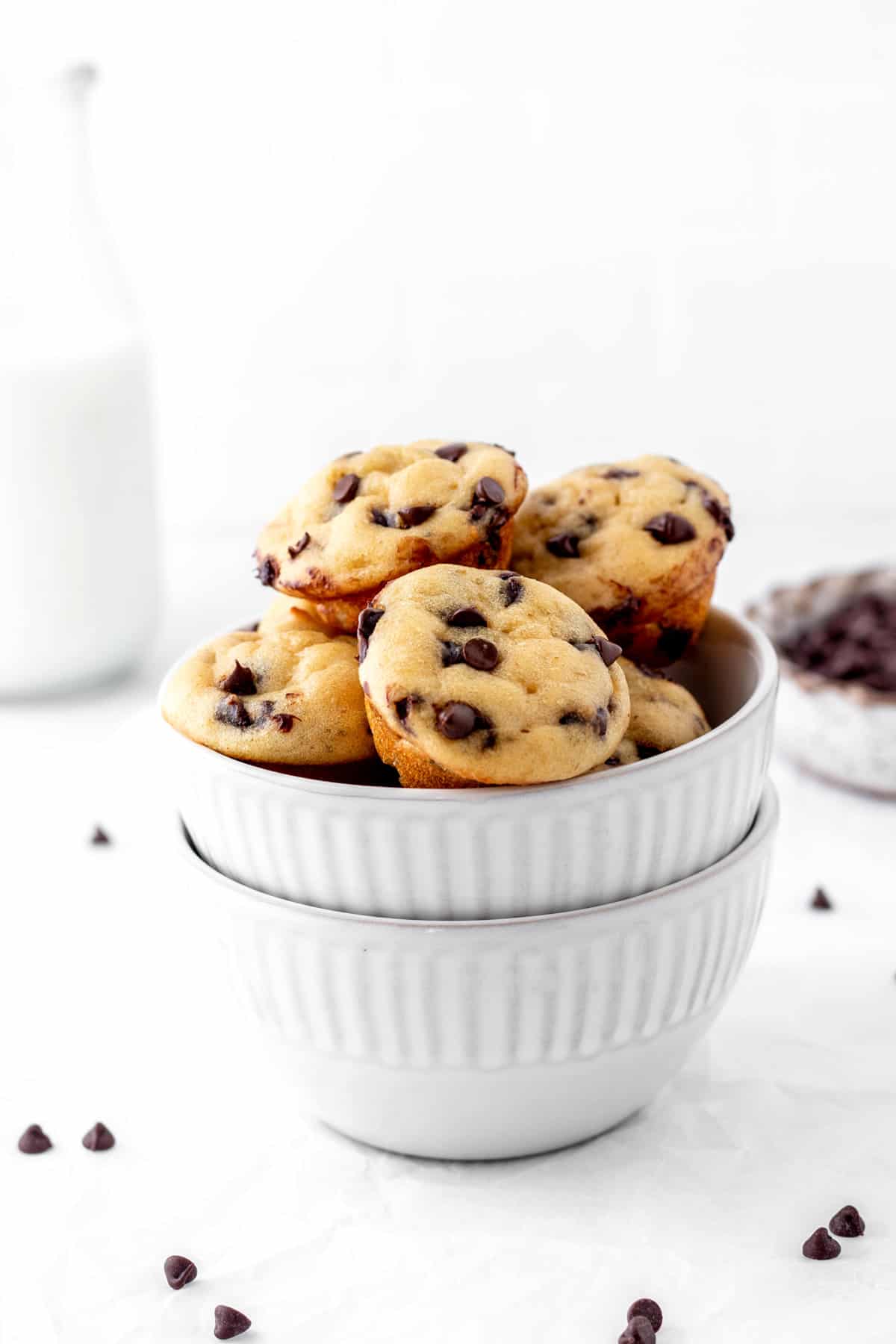 A small bowl of mini chocolate chip muffins without milk.