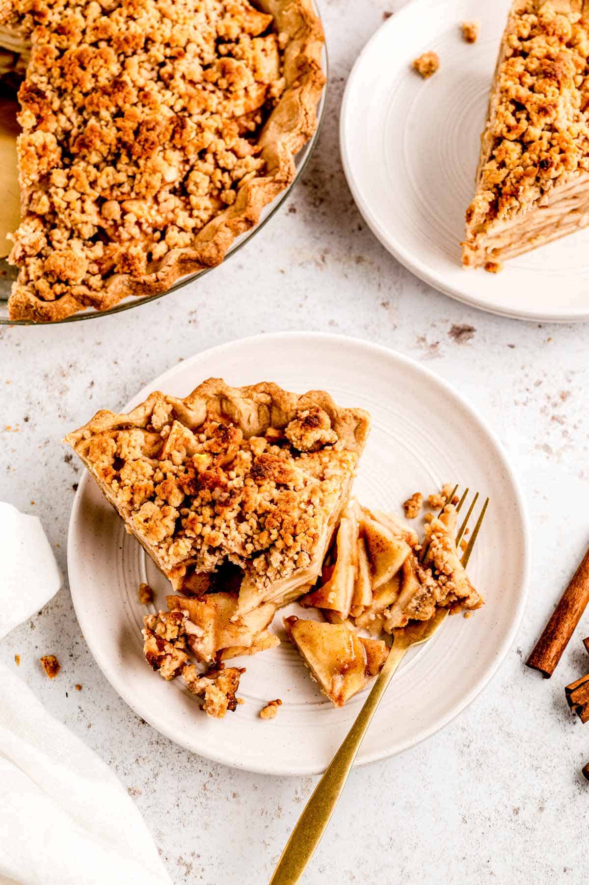 Overhead shot of healthier apple pie on a plate with a fork.