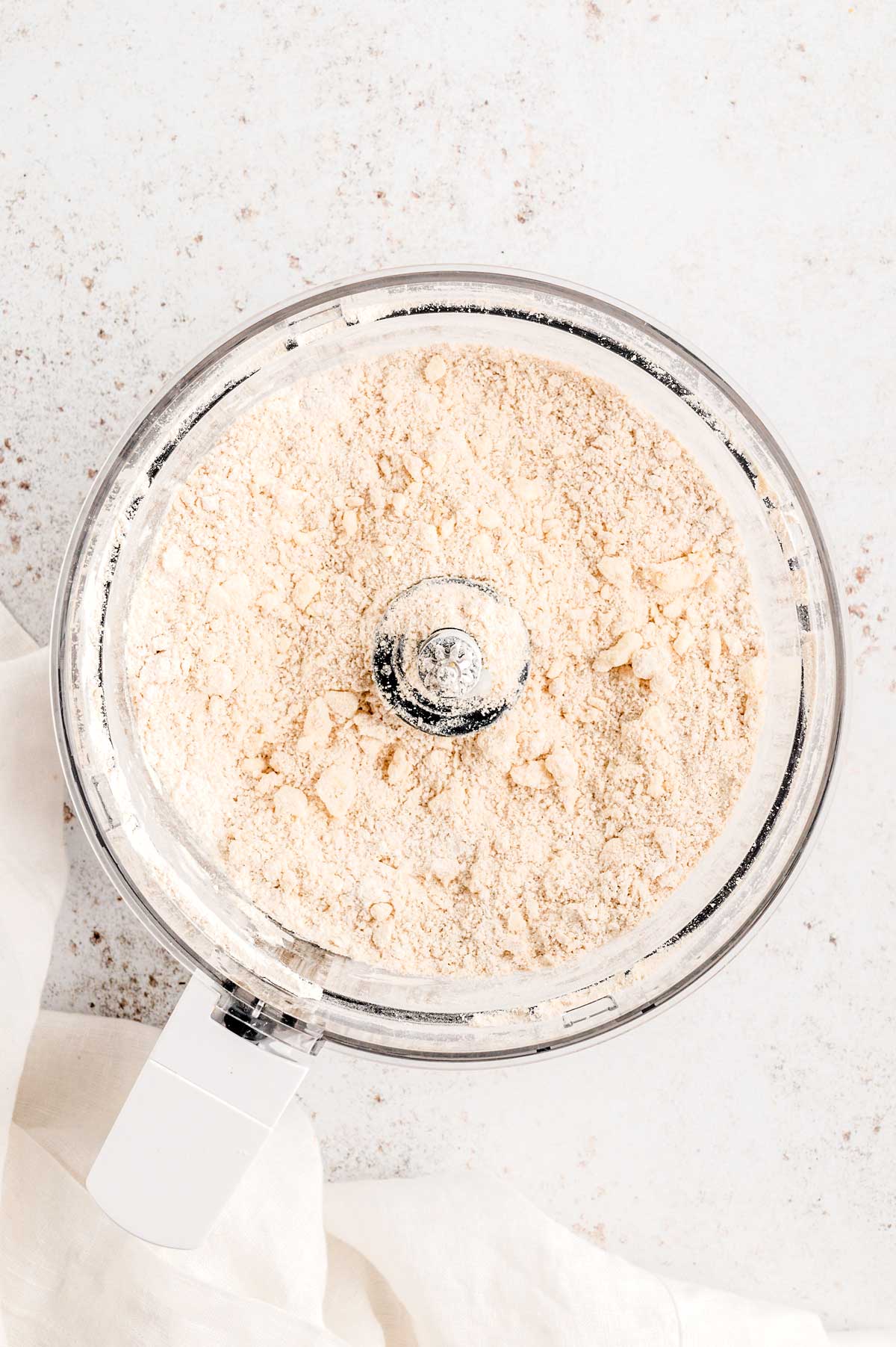 Butter and flour blended in a food processor to make dough.